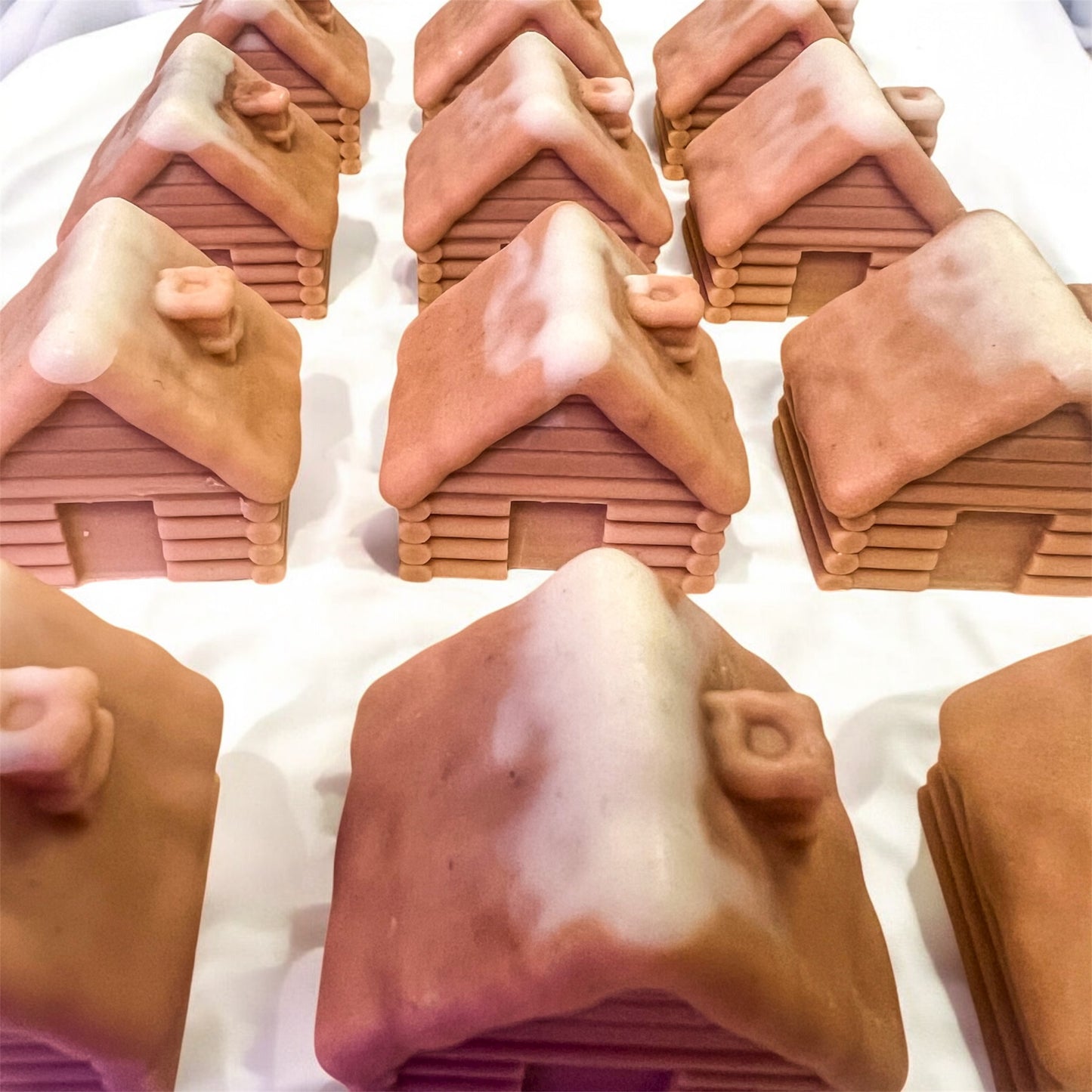 SNOW COVERED LOG CABINS