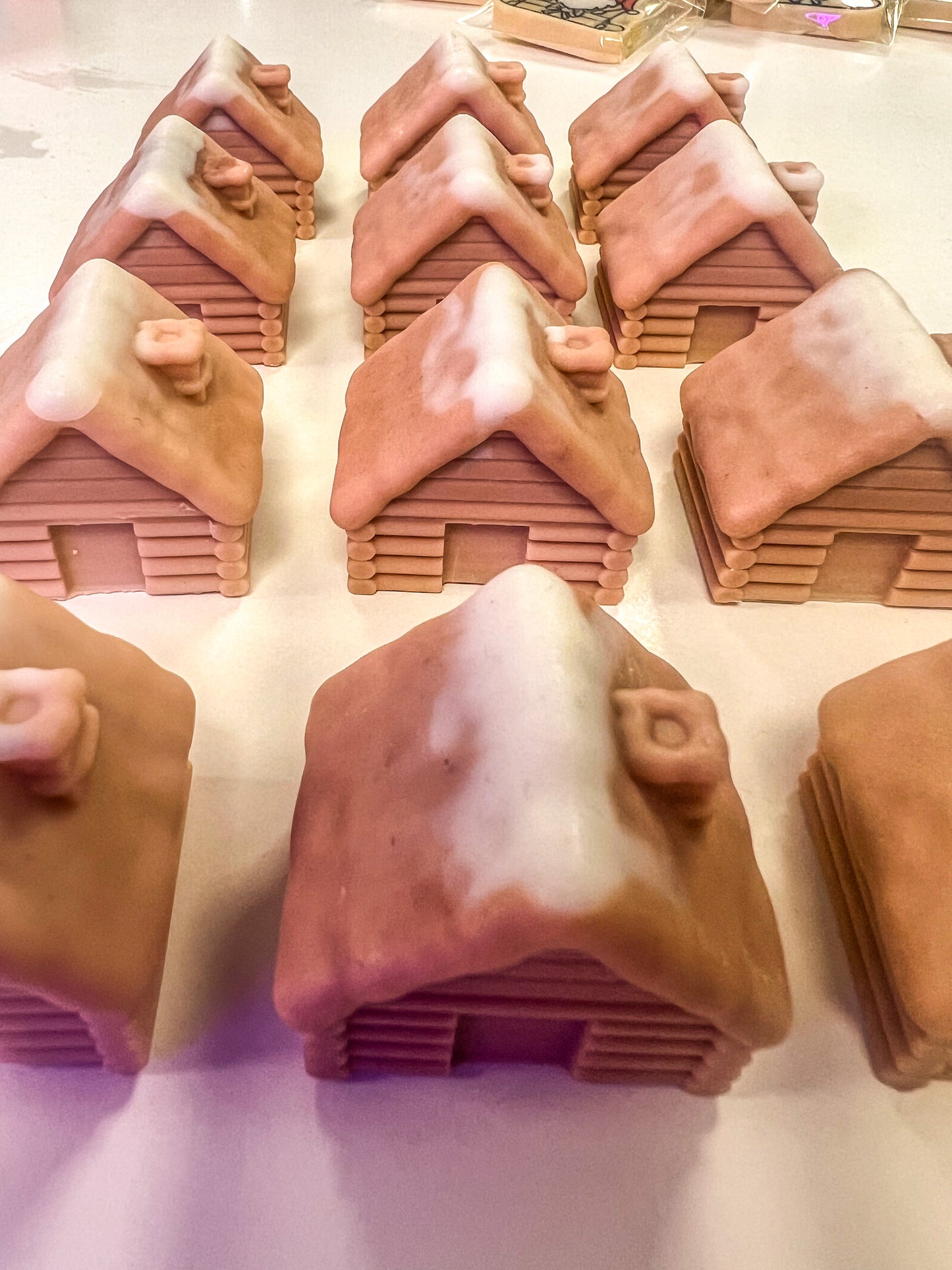 SNOW COVERED LOG CABINS